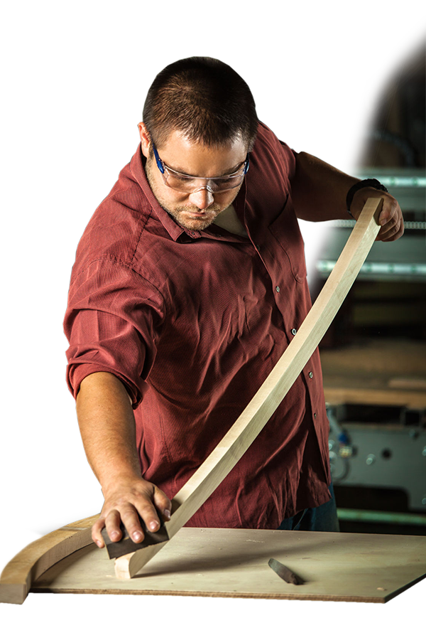 Supra Furniture craftsman shaping wood